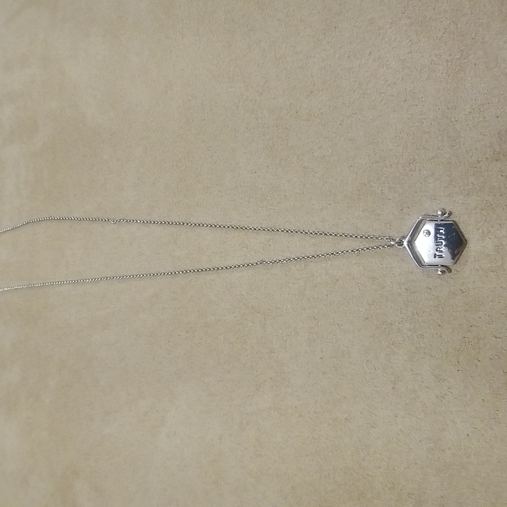 Juicy Couture silver plated flip truth & dare necklace worn once.